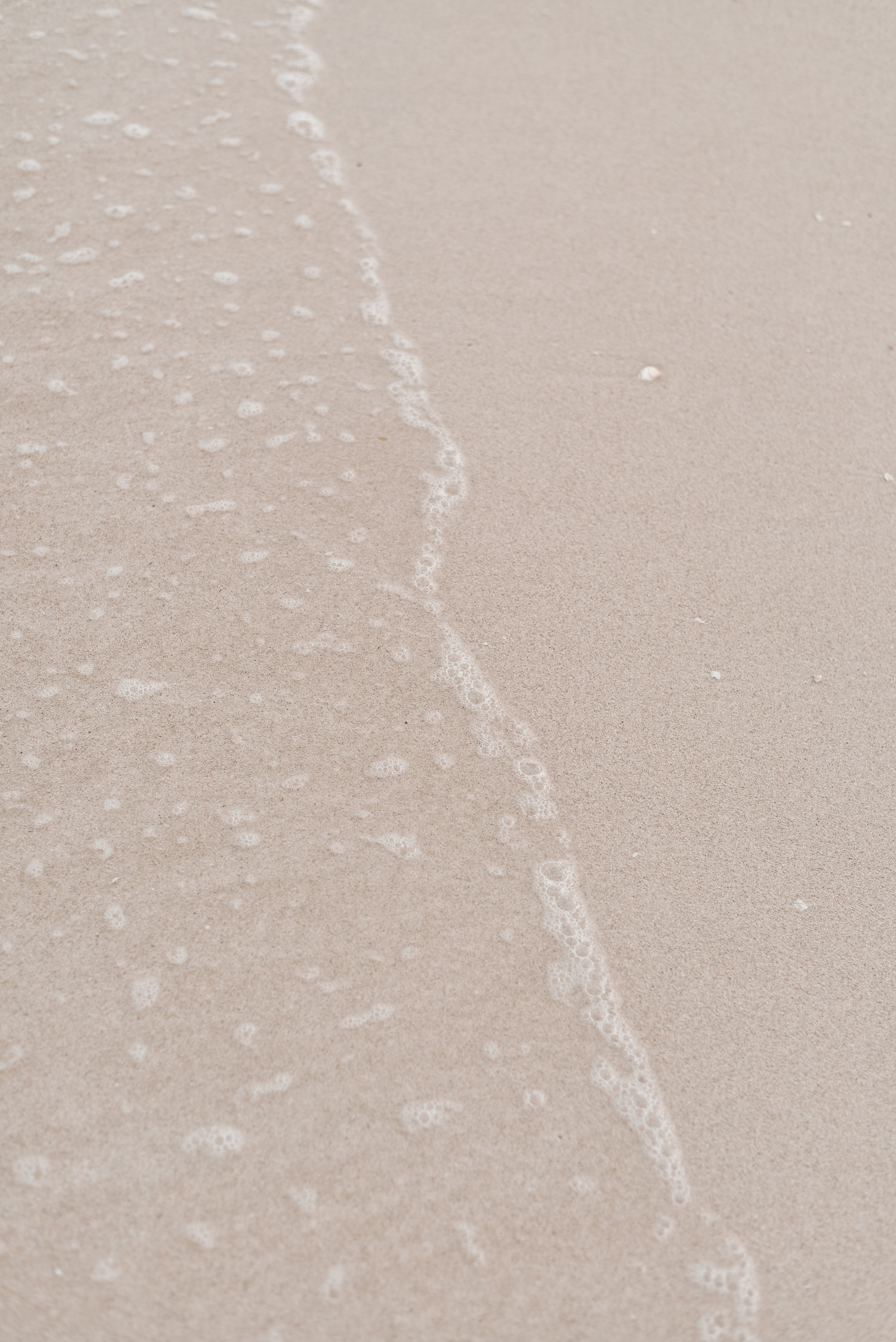 Sandy beach background. Beige color. Minimalist aesthetic